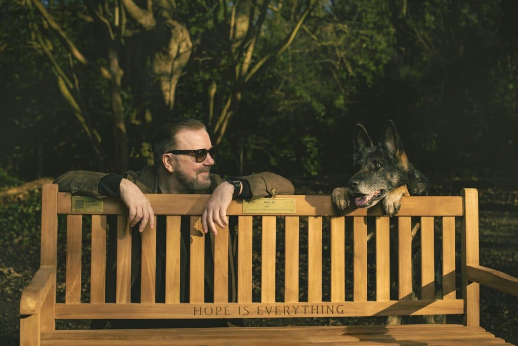 ricky-gervais-hanging-over-bench-from-after-life-with-dog