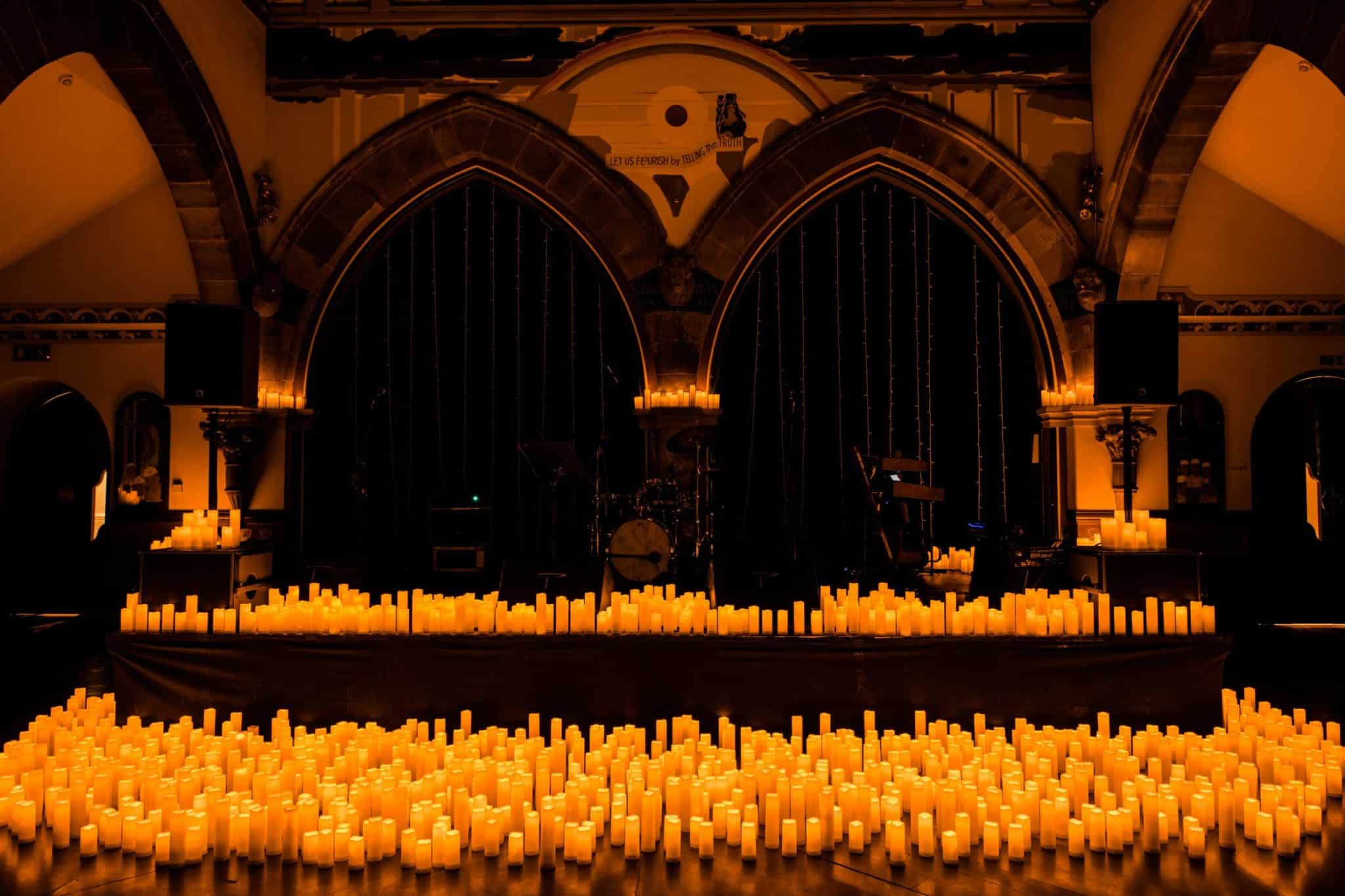 Hundreds of candles covering a stage inside Òran Mór for a Candlelight concert.